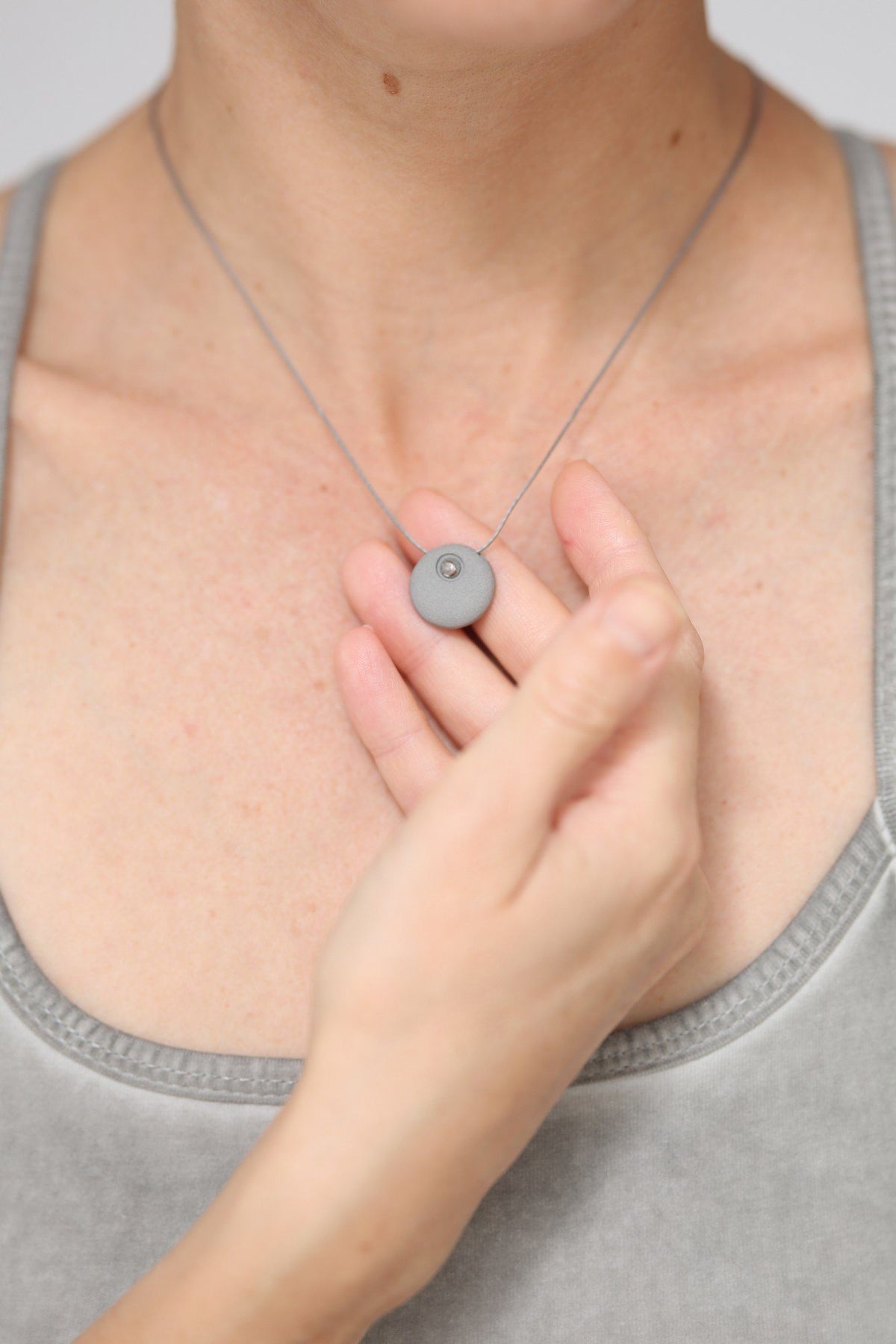 The Ripple Circle Necklace womens clothing Ripple Yoga Wear Grey clay with a platinum circle 