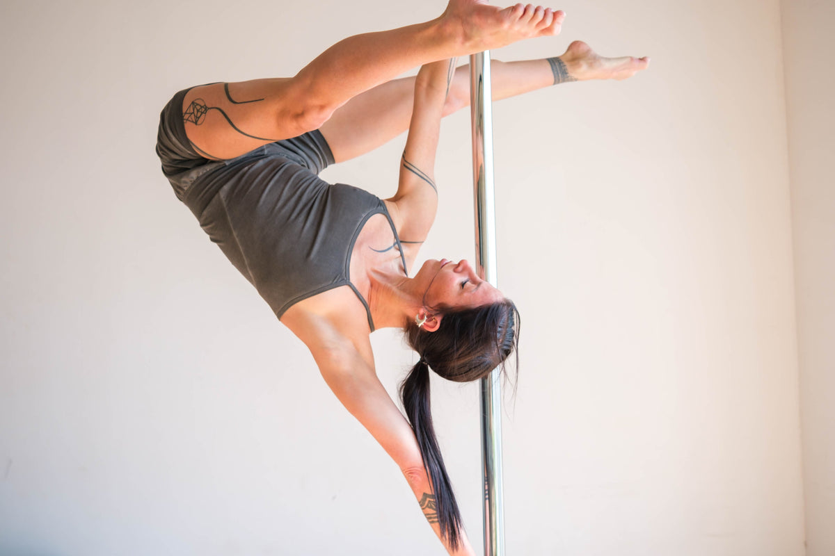 pole acrobatic with Ripple Yoga jumpsuit